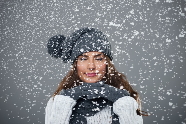 beautiful young woman enjoys first snow 329181 1721 Winter Skincare Tips Everyone Should Know