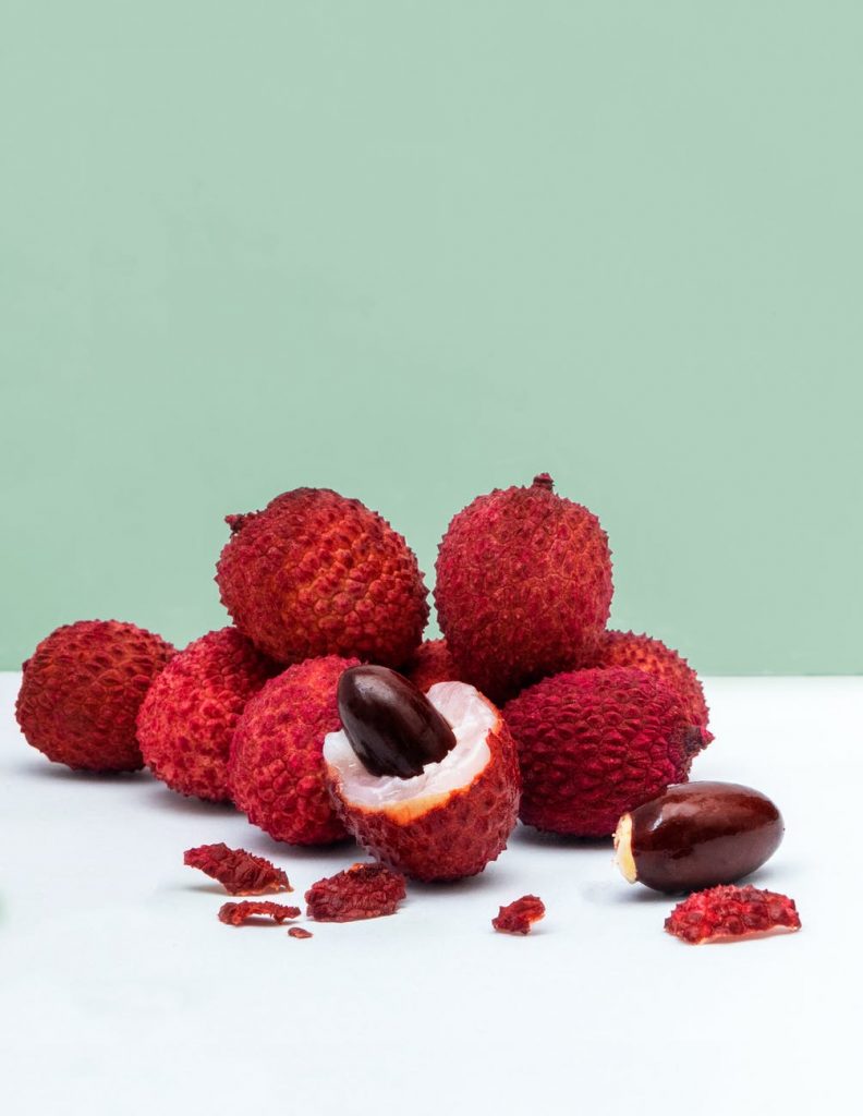 lychee fruits on white surface